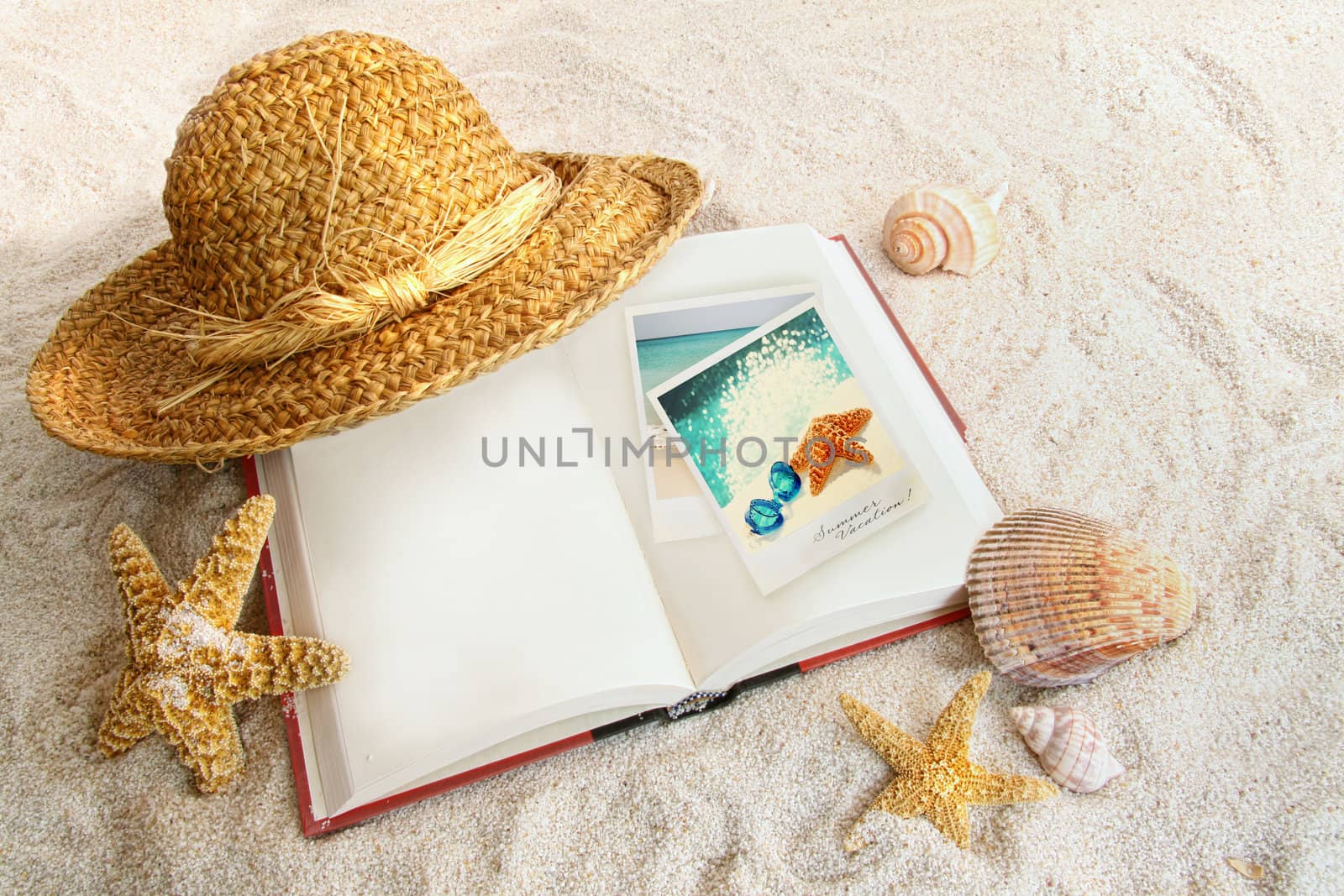 Book with straw hat and seashells in sand by Sandralise