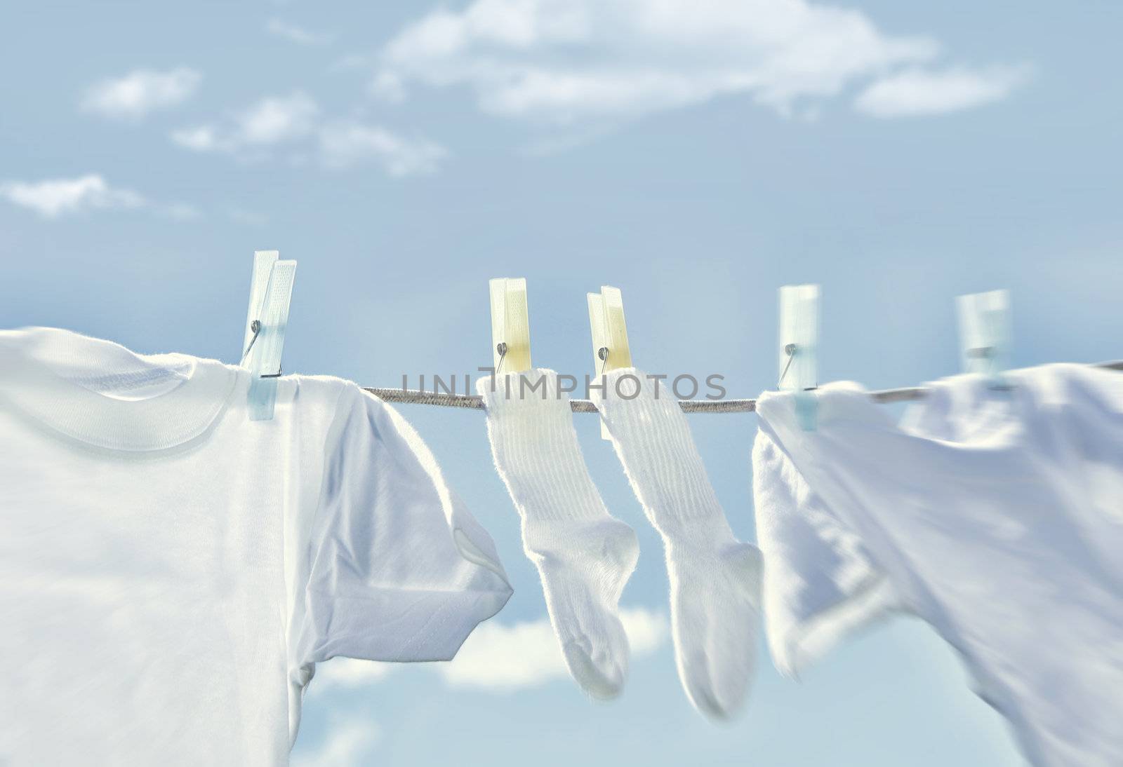 Clothes hanging on clothesline by Sandralise