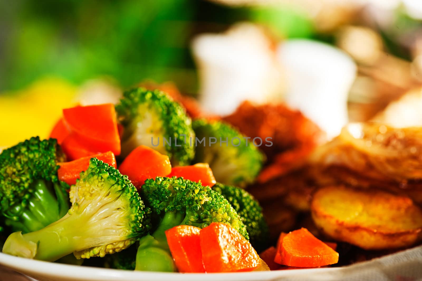 Fried potatoes broccoli carrots and roasted chicken