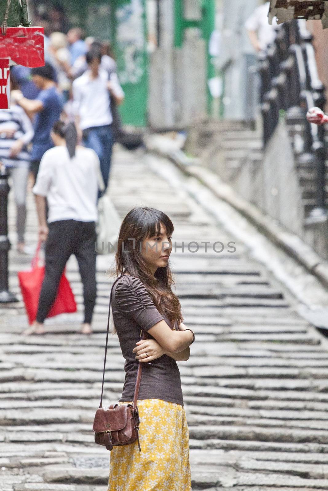 Asian woman waiting alone