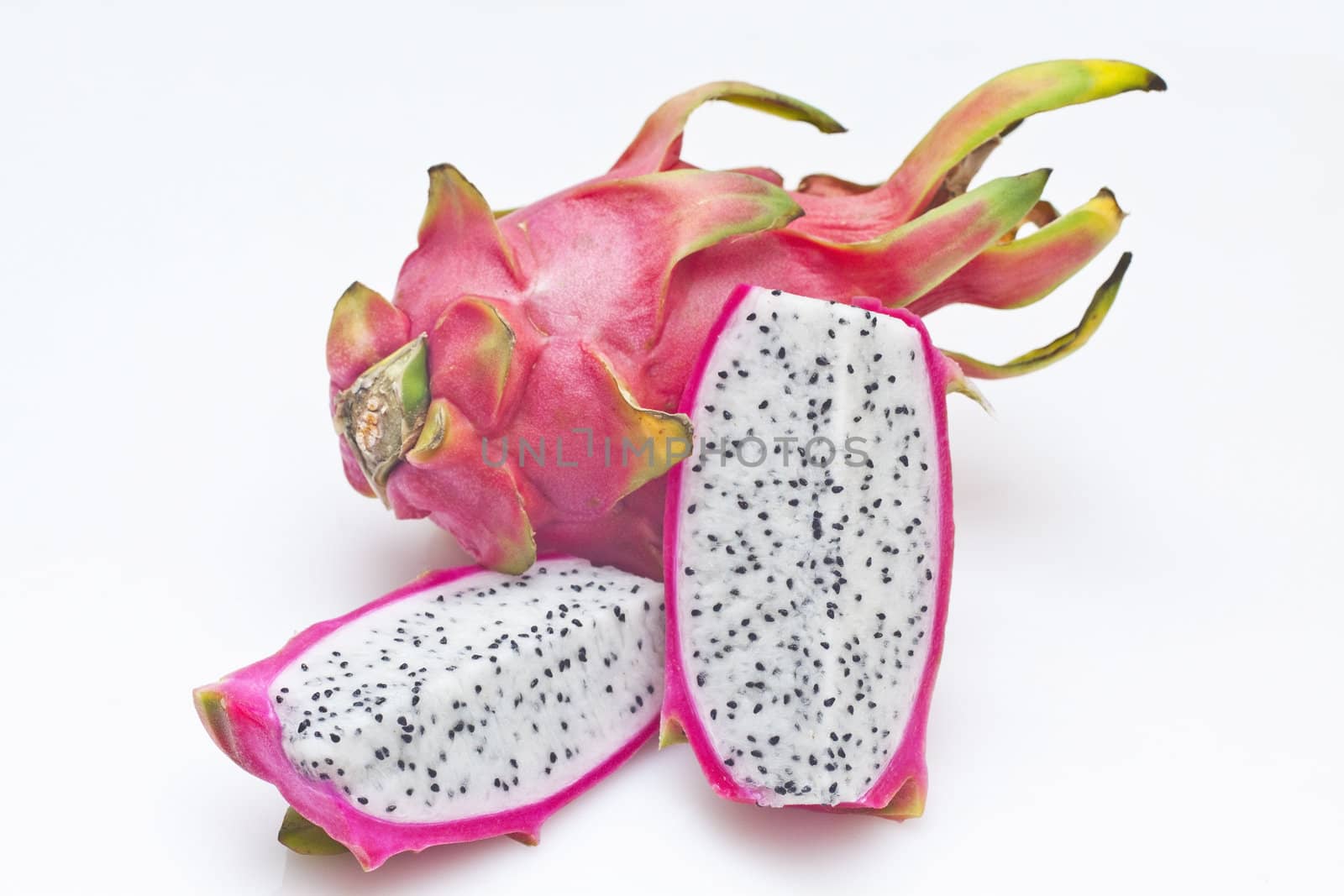 Vivid and vibrant dragon fruit isolated on white background by kawing921