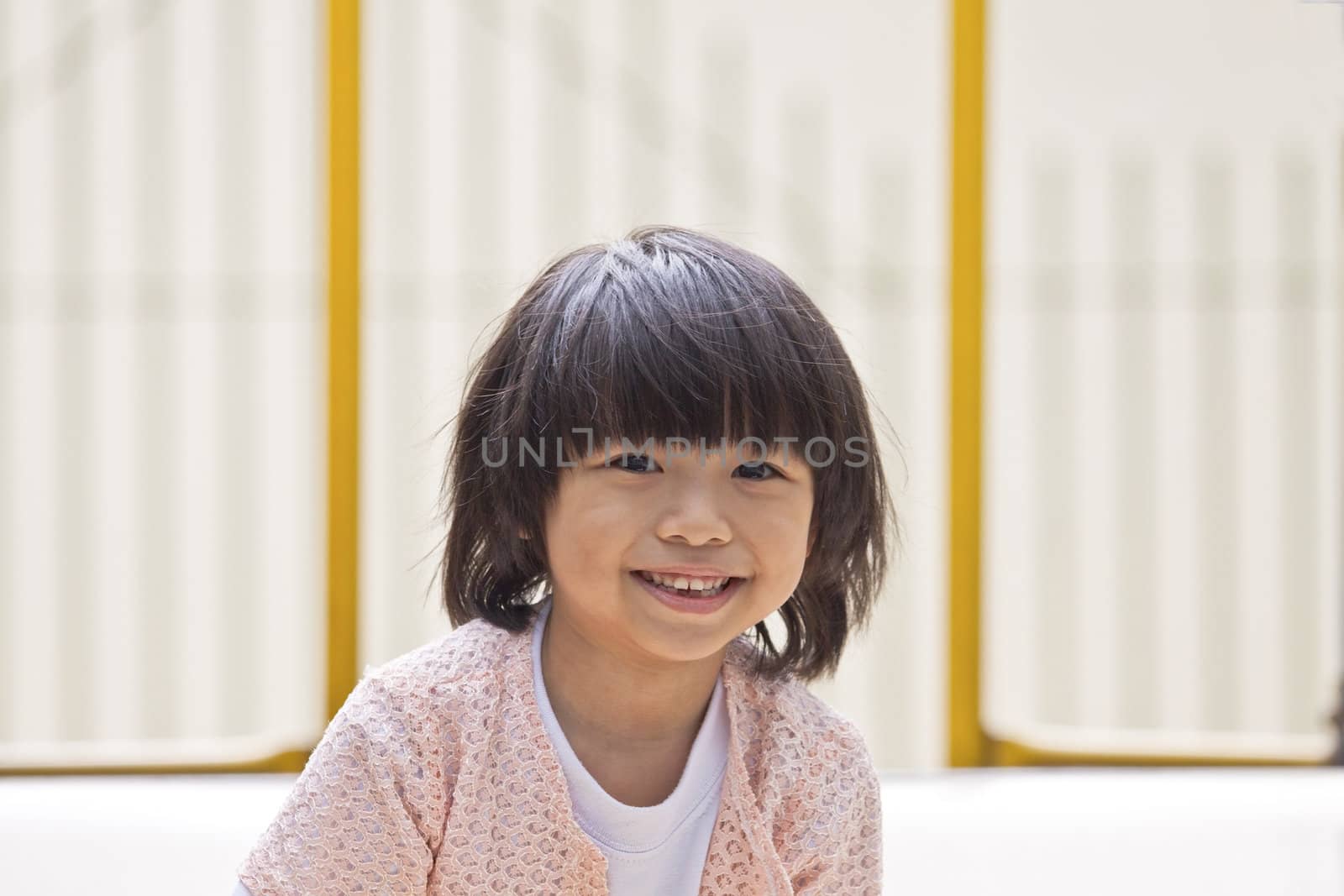 A young asian girl smiling