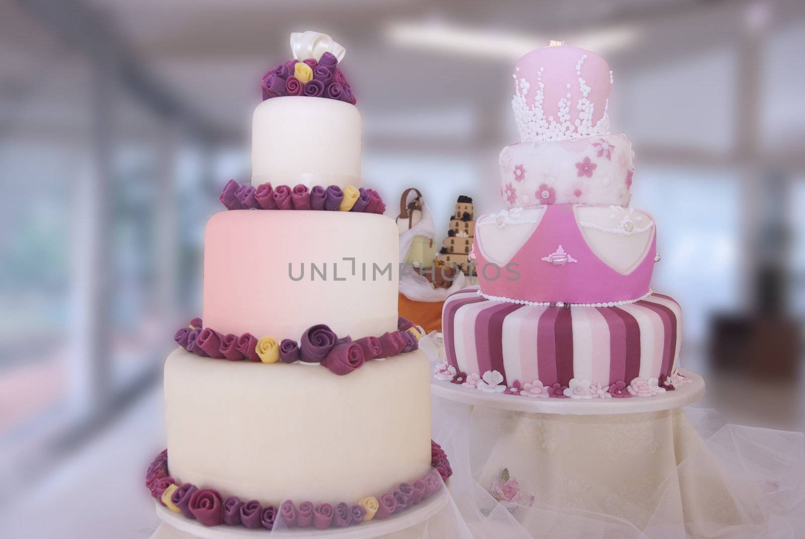 display of artistic wedding cakes