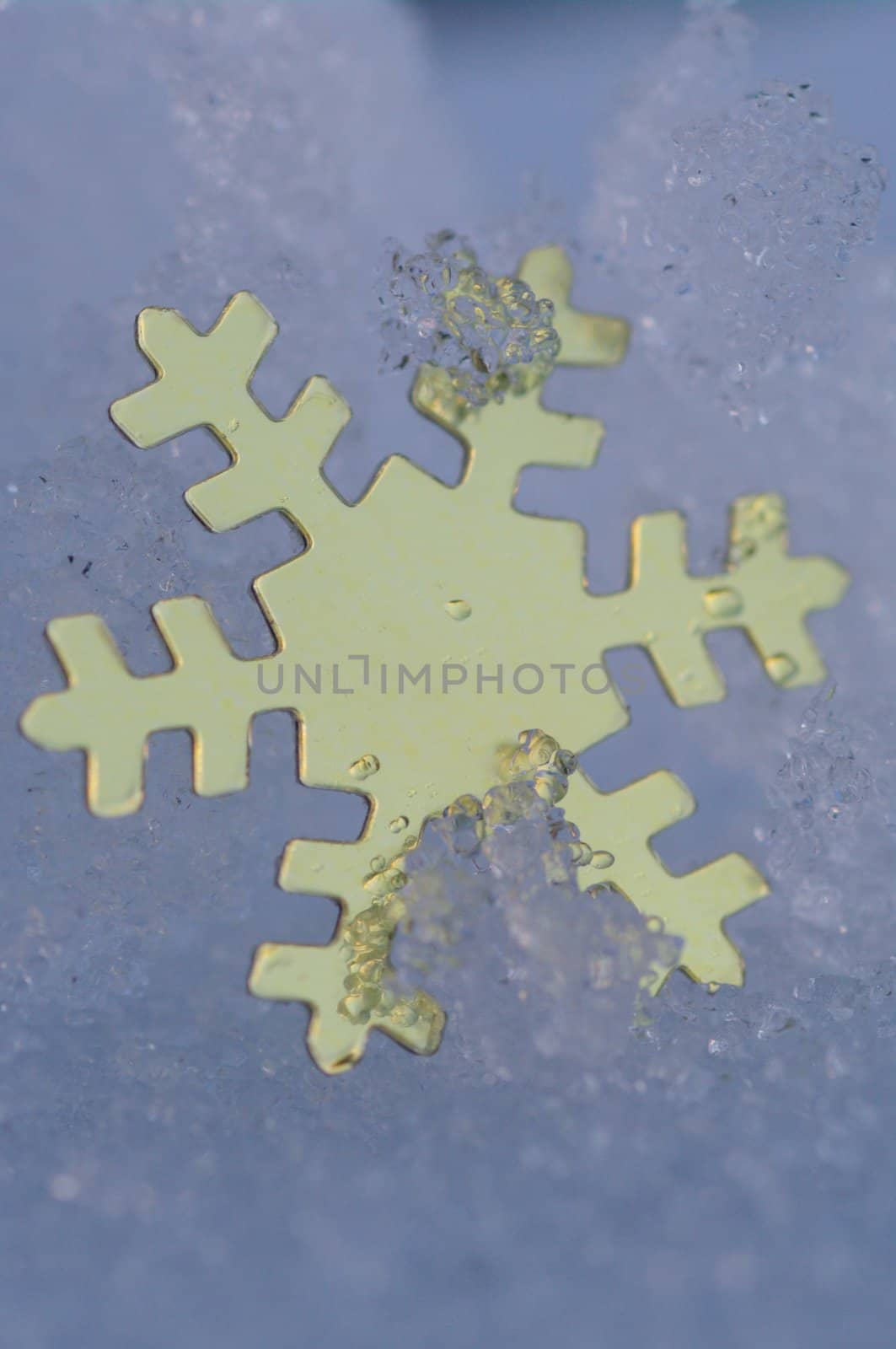 golden snow stars on a real snowy icy surface