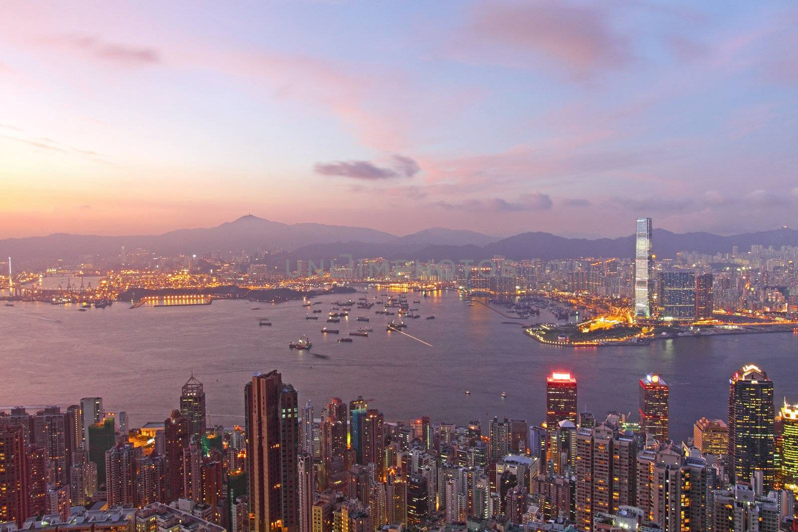 Hong Kong and office buildings at sunset time, it shows the prosperity of this city.