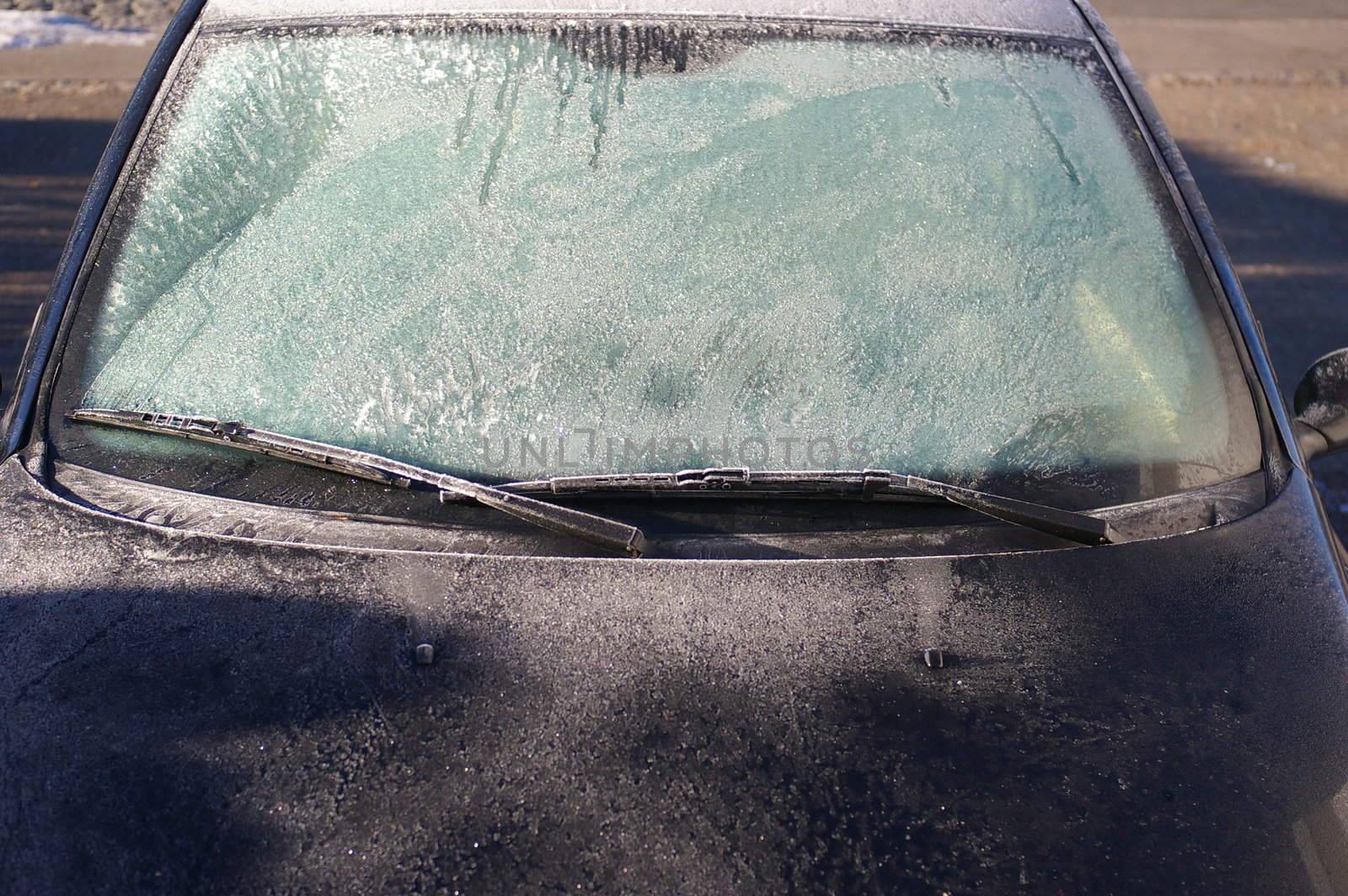 car windshield covered with ice