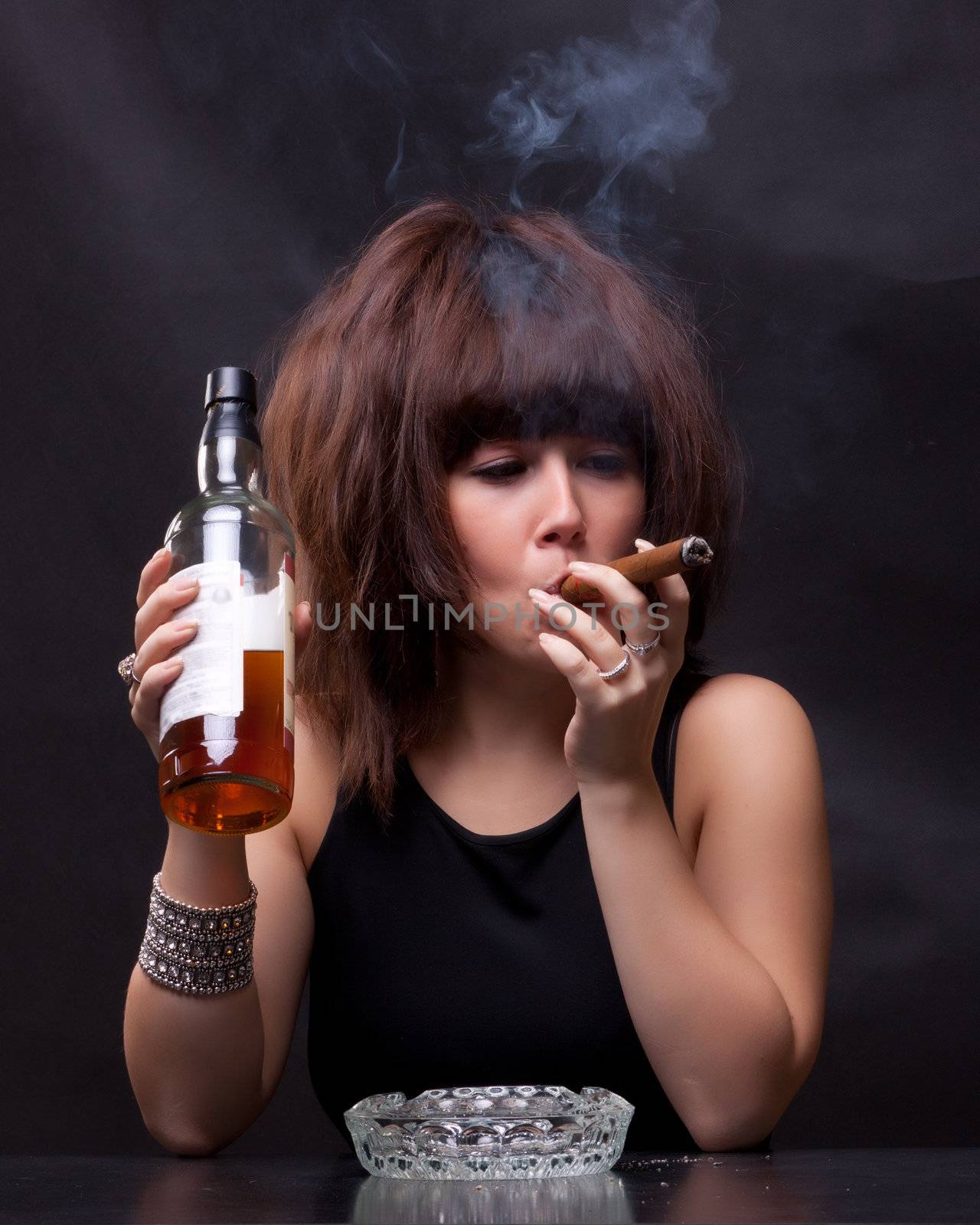 woman drinks alcohol and smokes a cigar by Discovod