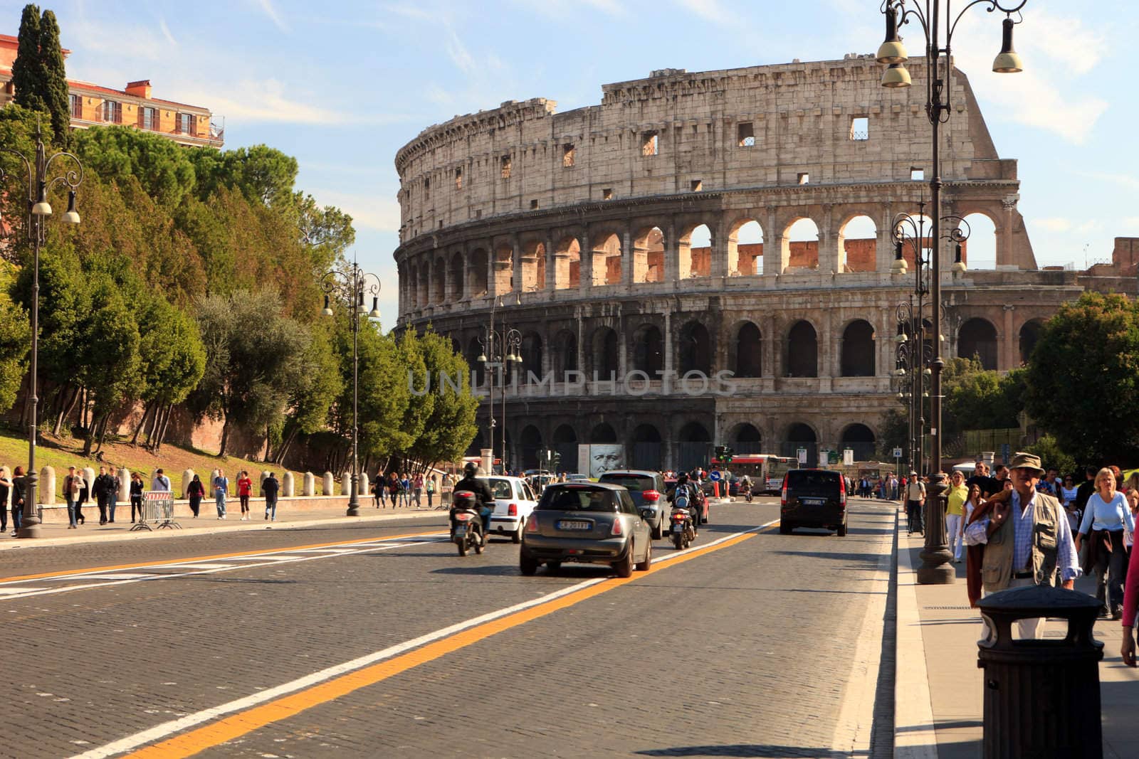 Modern road leading to the Rome Colosseum Italy