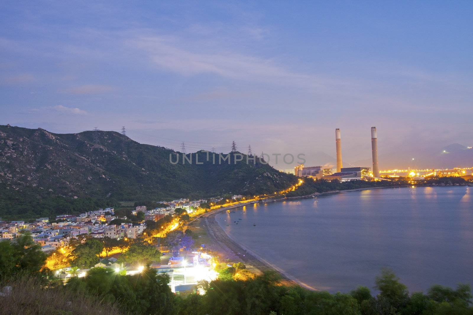 Power station along the seashore at night  by kawing921