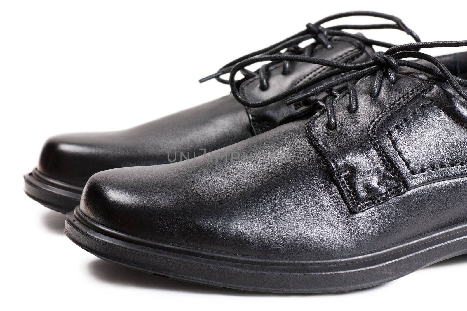 Macro view of men black shoes with black laces