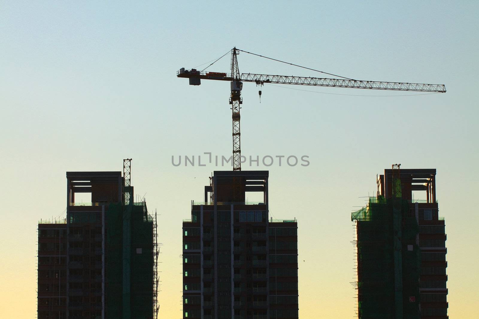 Construction site with crane and building  by kawing921