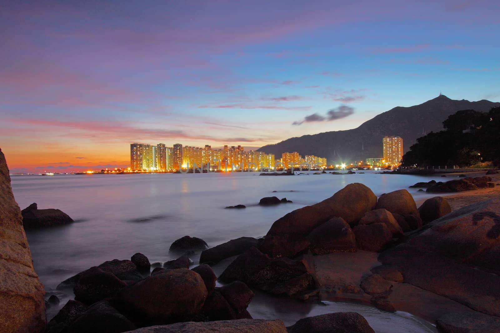 Sunset along seashore with long exposure of sea stones by kawing921