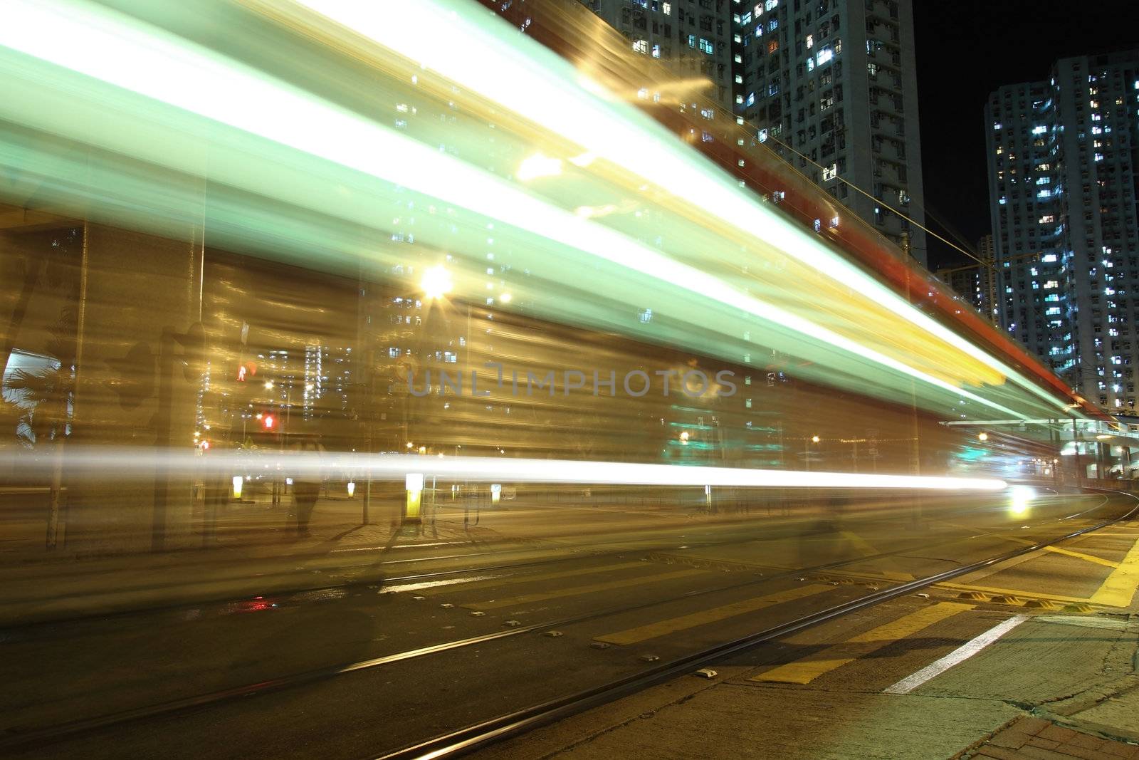 Traffic in Hong Kong at night, light rail.