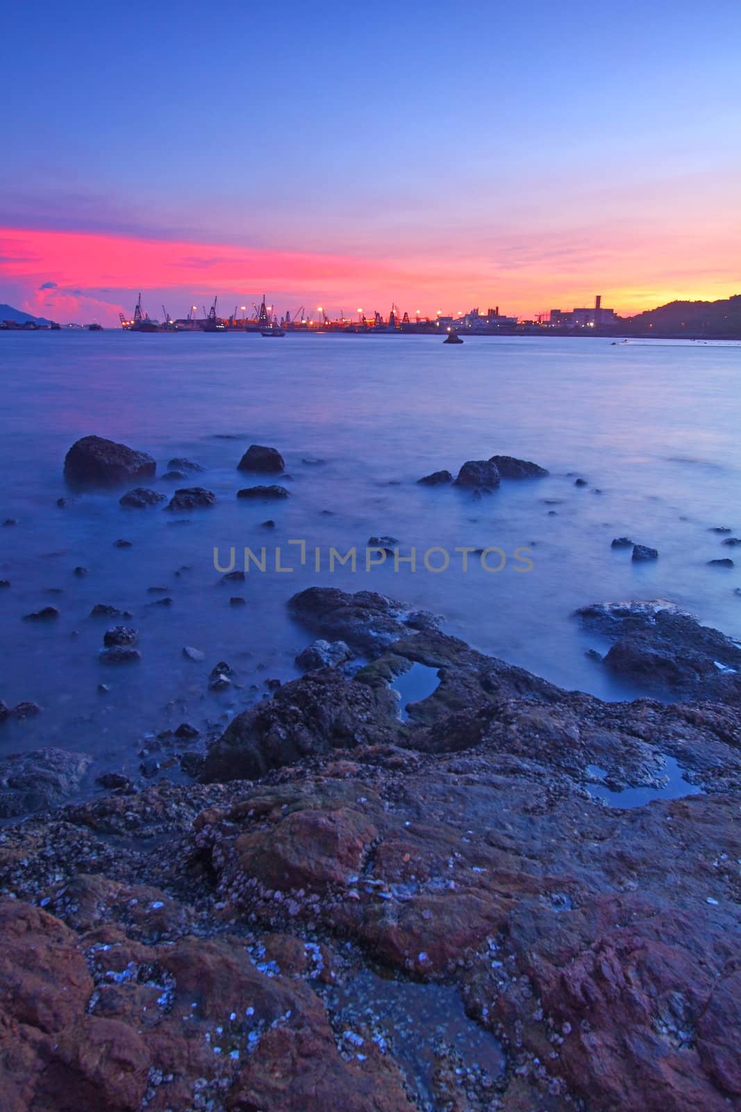 Sunset along the coast, long exposure of rocks by kawing921