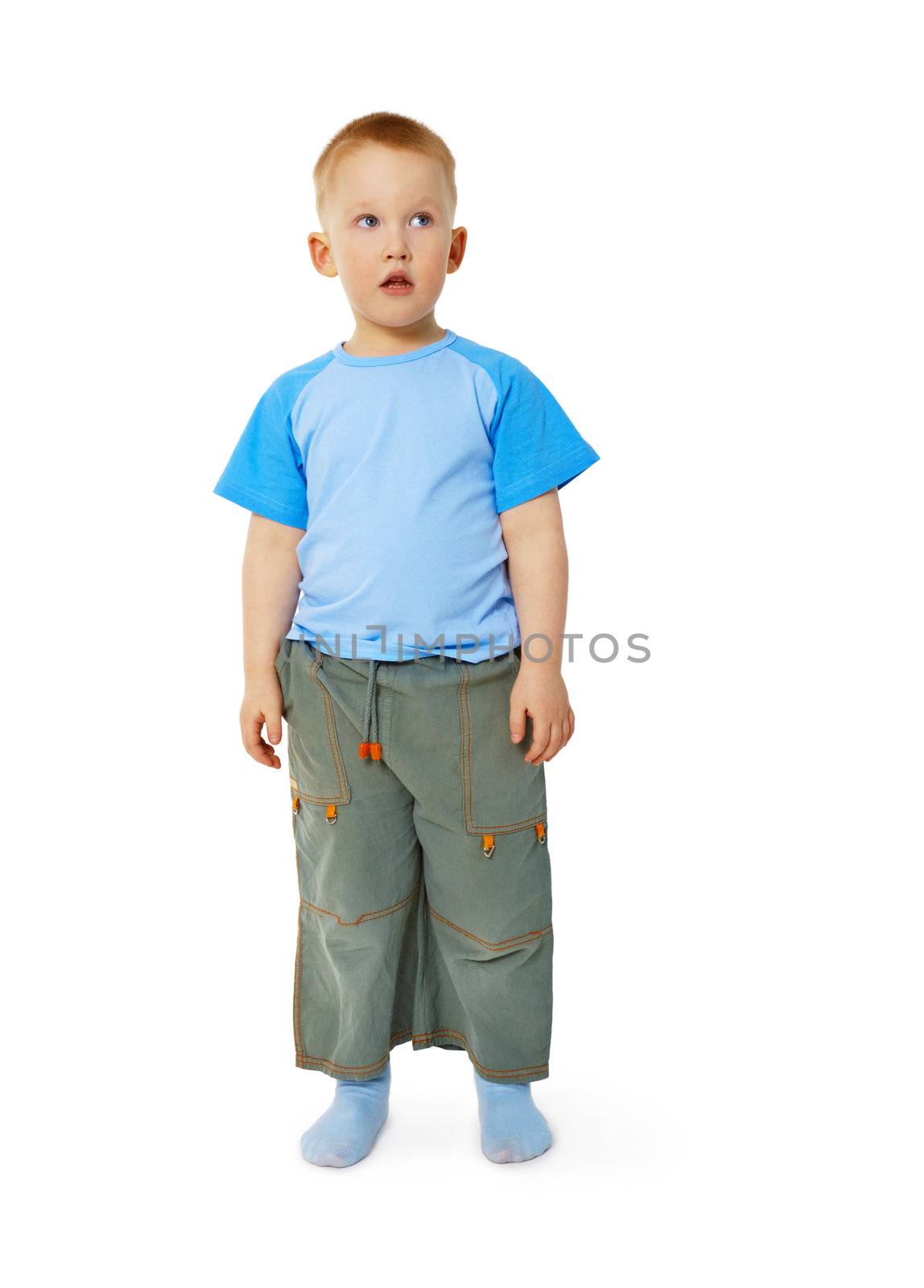 Funny little boy stands isolated on white background