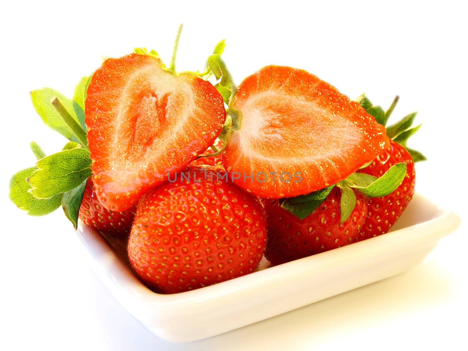 Strawberry fruit, on white plate isolated towards white background