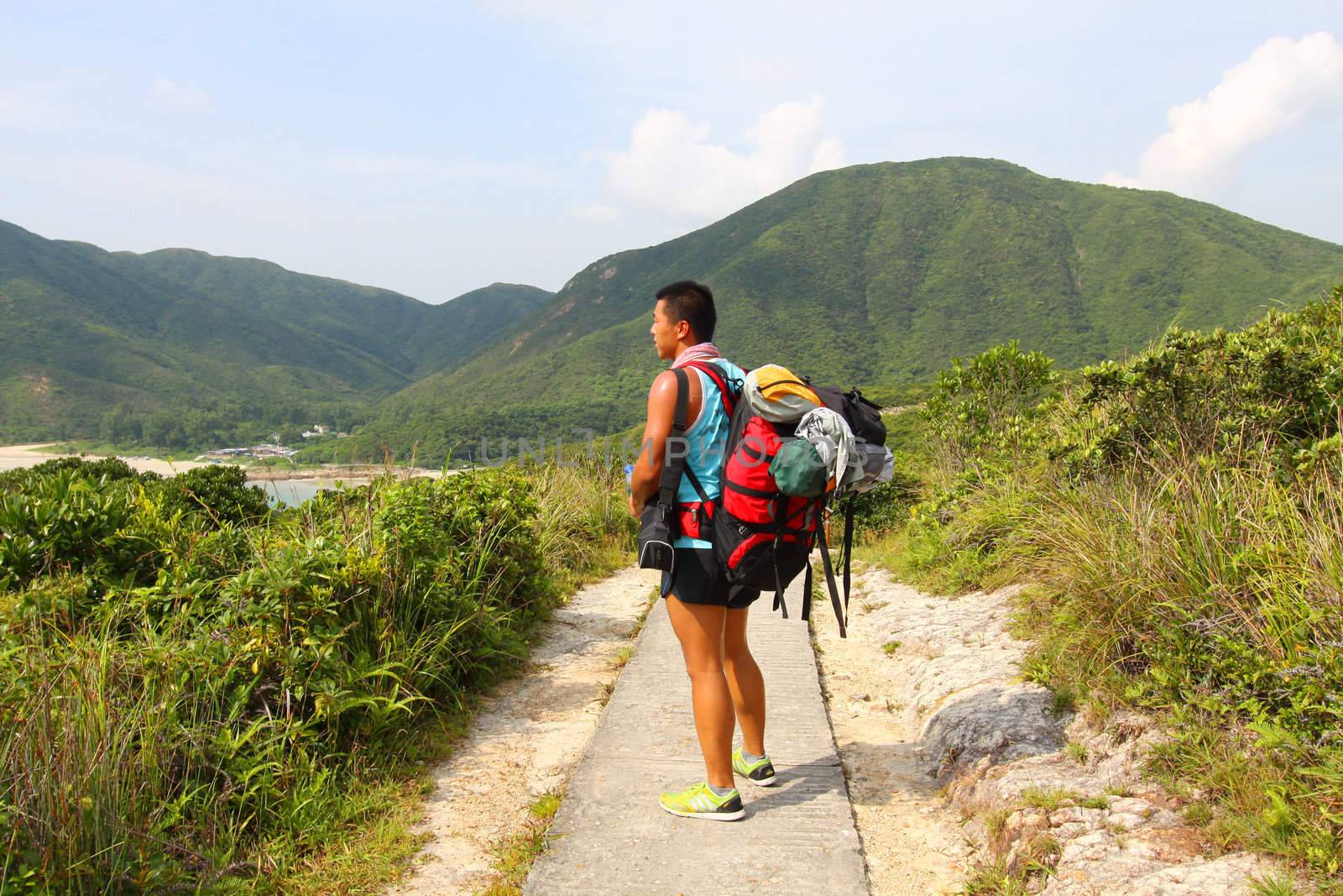 Asian man hiking at summer time by kawing921