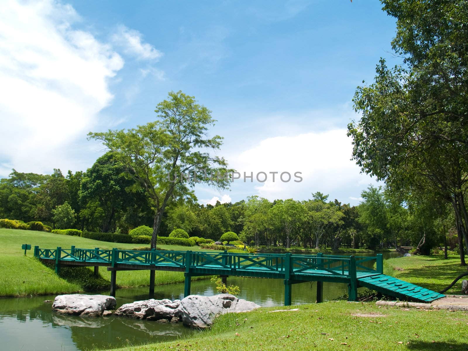 Green wooden bridge in Buddhamonthon, Nakhon Pathom, Thailand