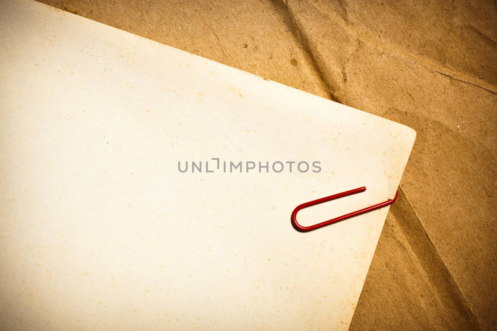 Vintage paper with Paper clip by Suriyaphoto