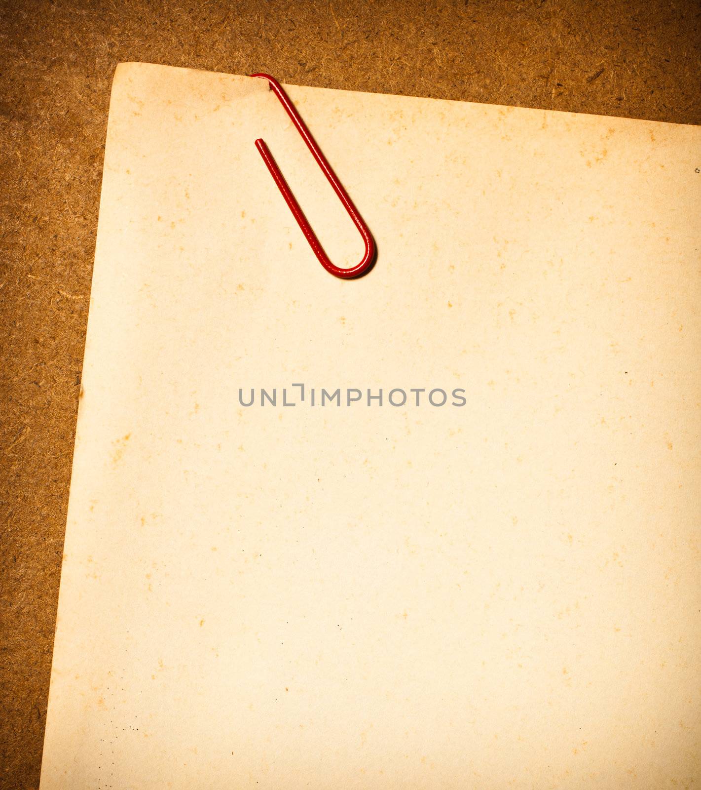 Vintage paper with Paper clip by Suriyaphoto