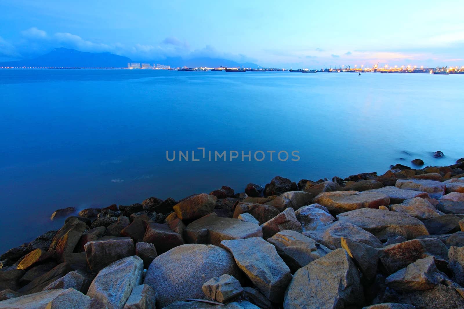 Sunset along the coast in Hong Kong with rocks