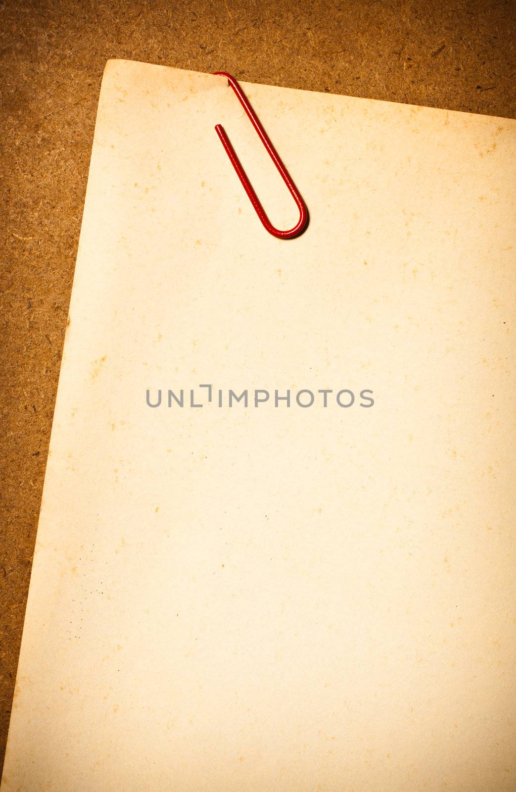 Vintage paper with Paper clip by Suriyaphoto