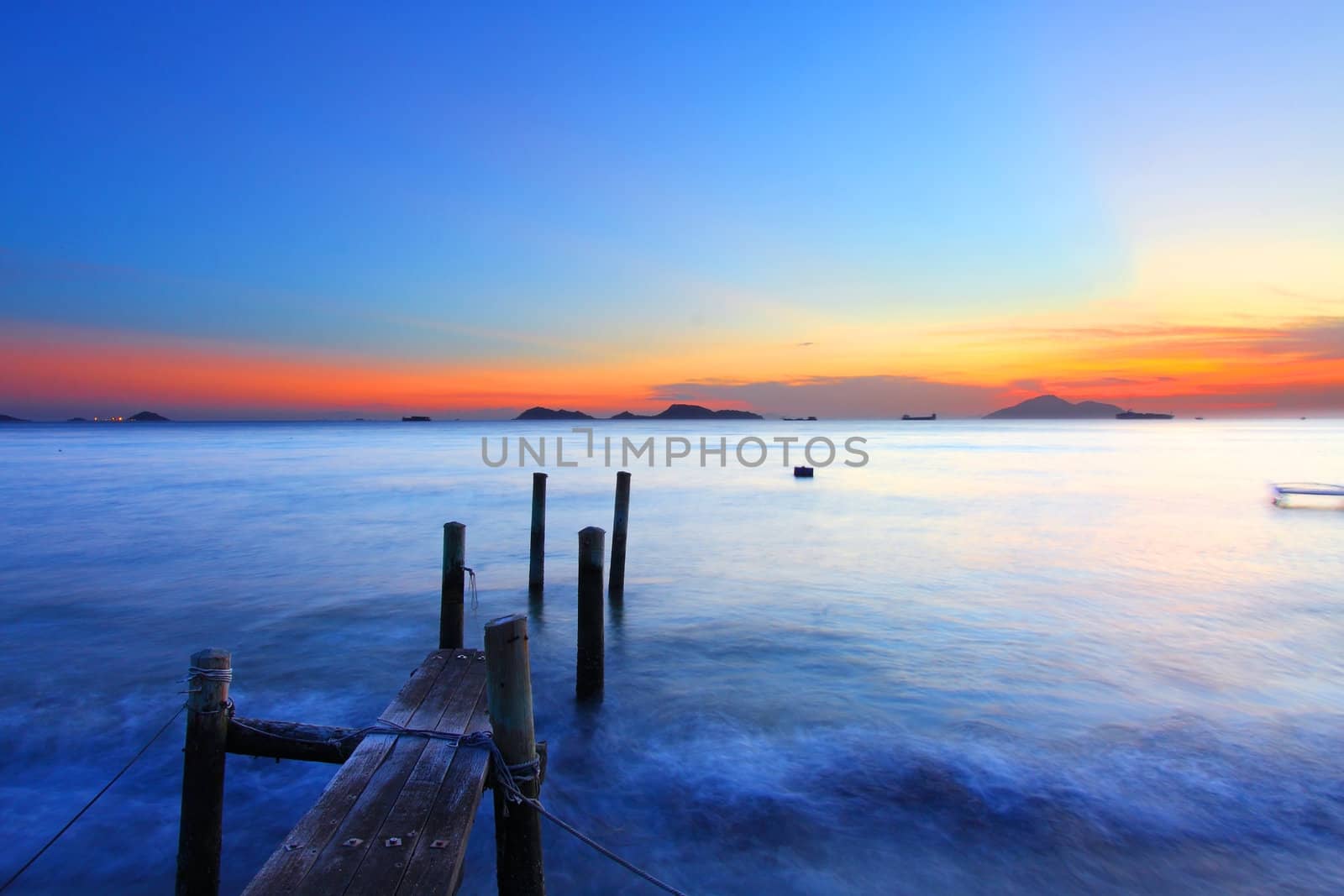 Sunset along a wooden pier in Hong Kong