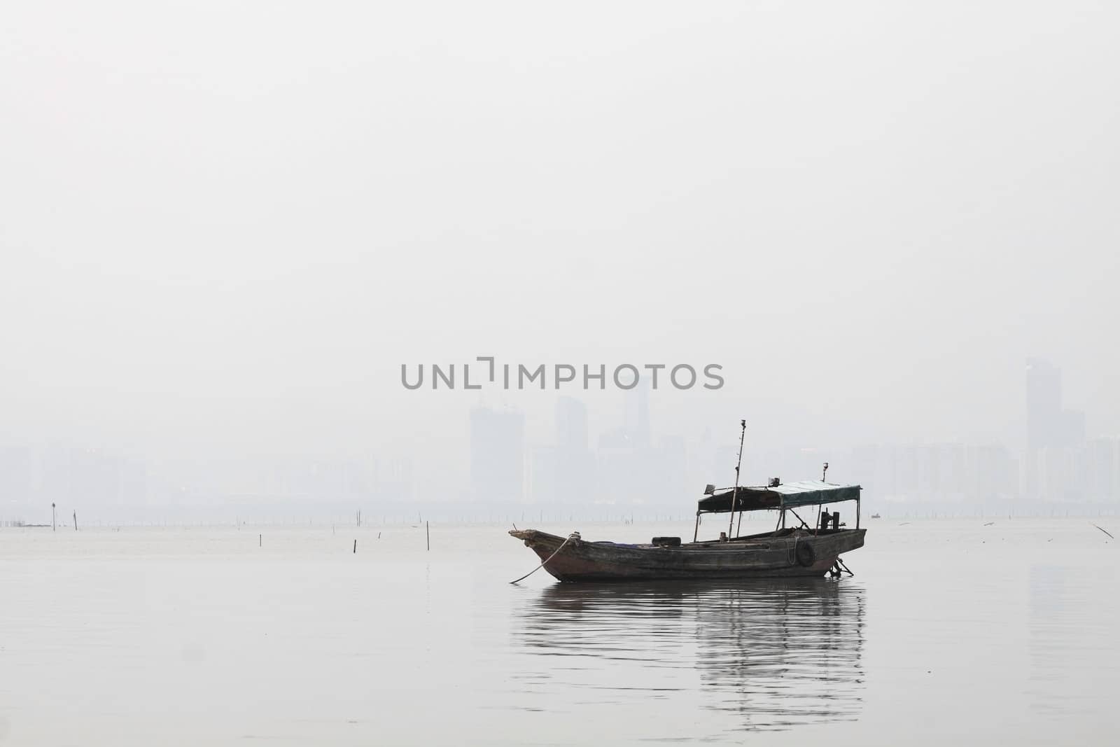 Lonely boat on the sea in black and white toned by kawing921