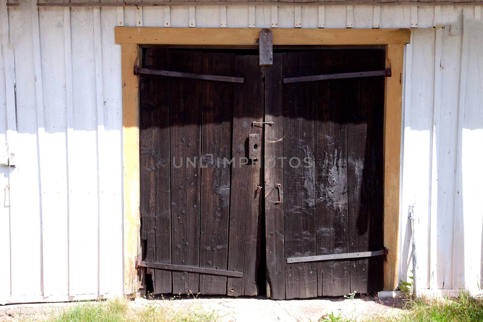 Old wooden door with rosty hinges