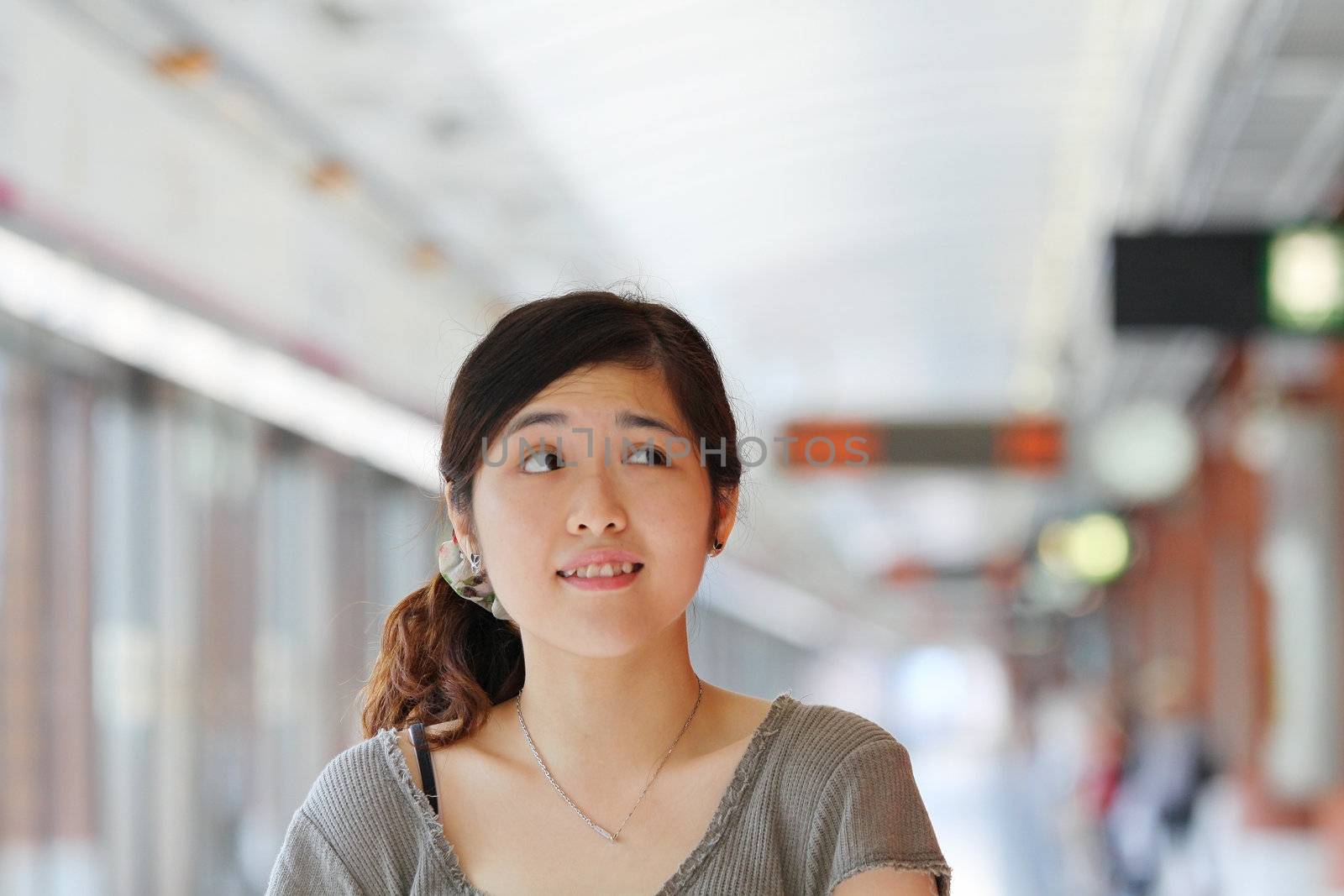 Asian woman thinking with curiousity