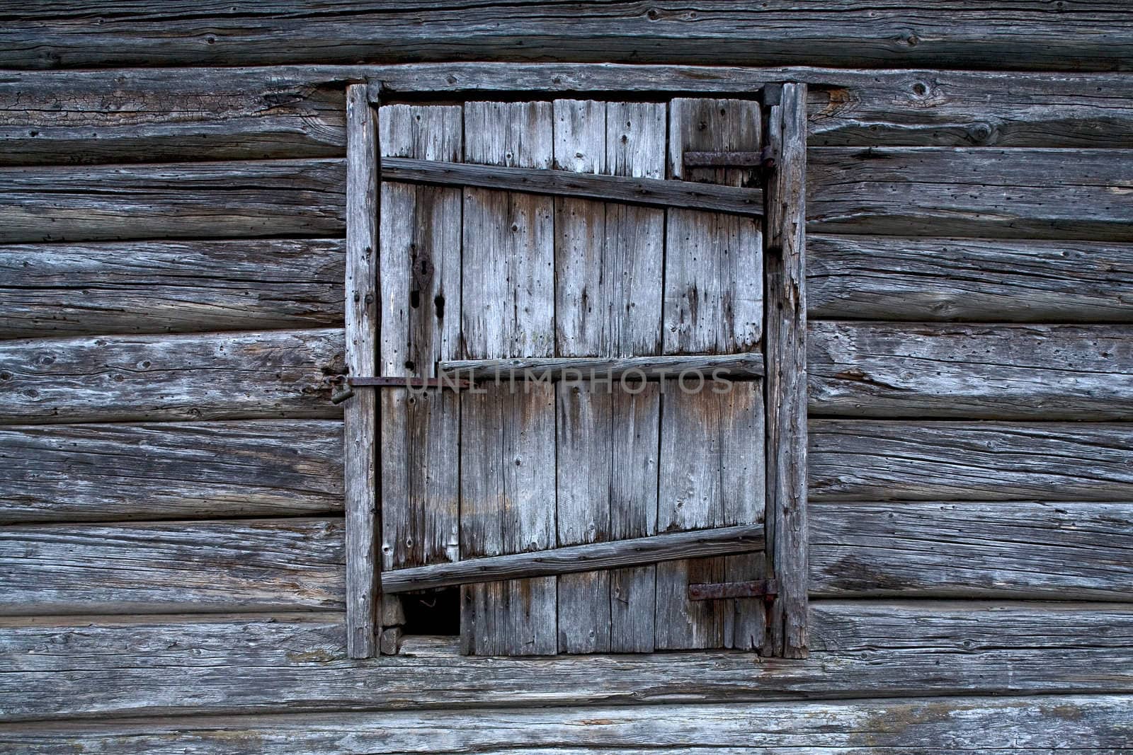 Old wooden door with rosty lock