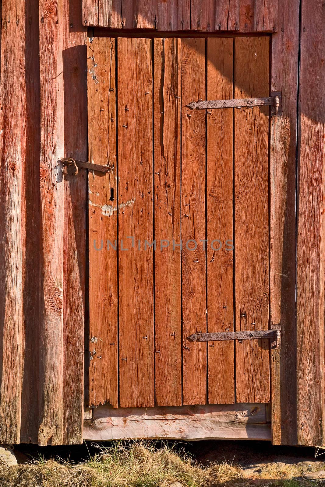 Old wooden door with rosty lock
