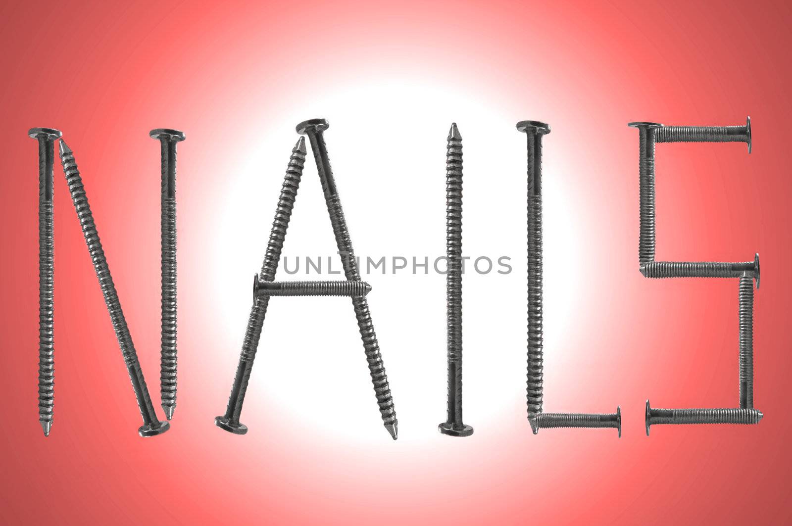 Close up of several steel nails arranged to form the word NAILS over a red light effect