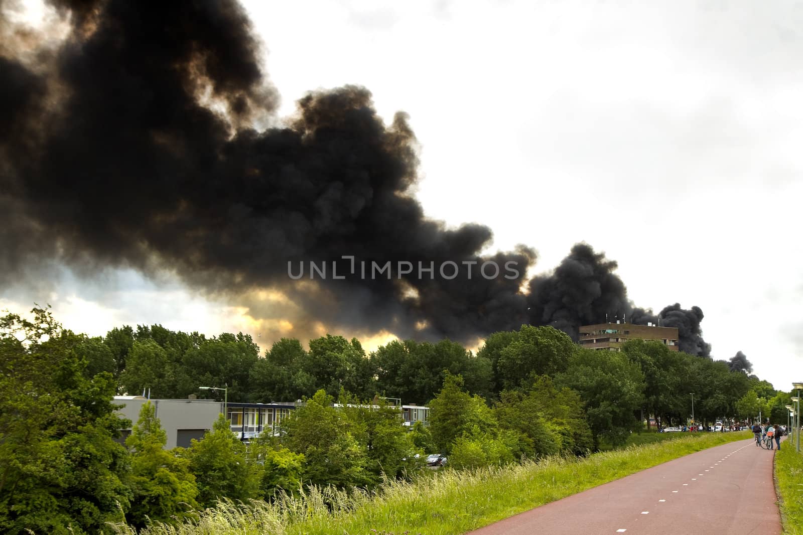 Fire in recycling factory with heavy smoke by Colette