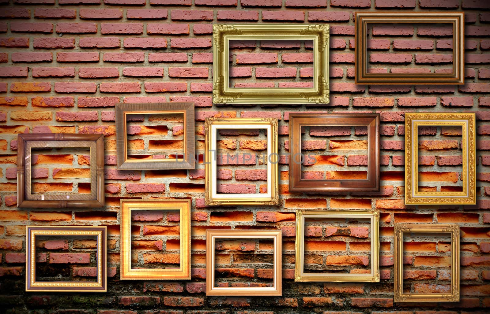 golden vintage frame on the old grunge brick wall by rufous