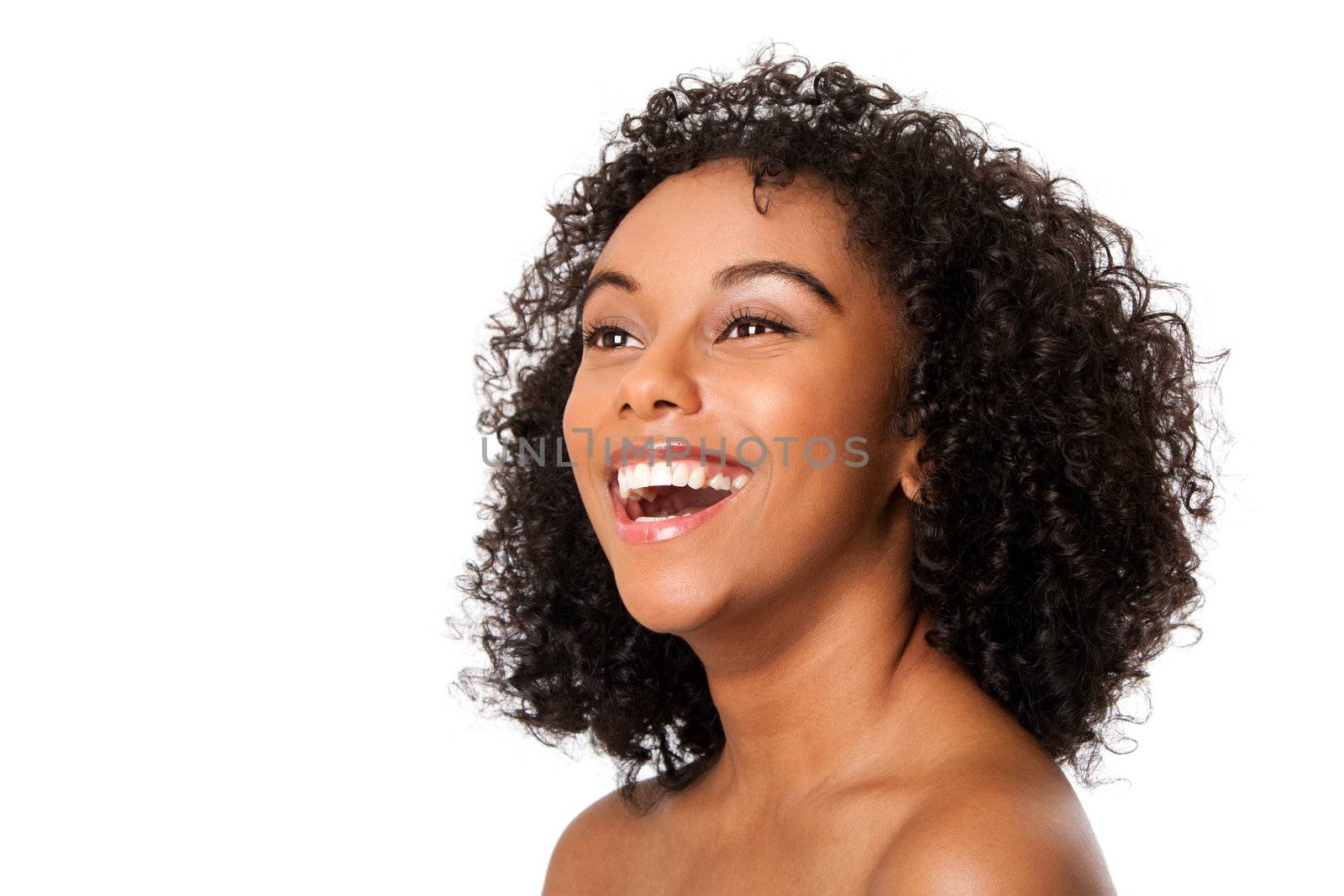 Face of a beautiful happy smiling laughing young female teenager fashion model with curly hairstyle, isolated.