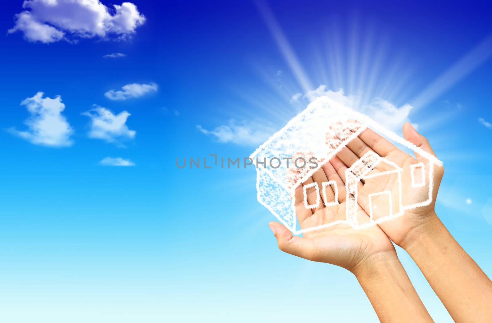 The House in the hands against the blue sky