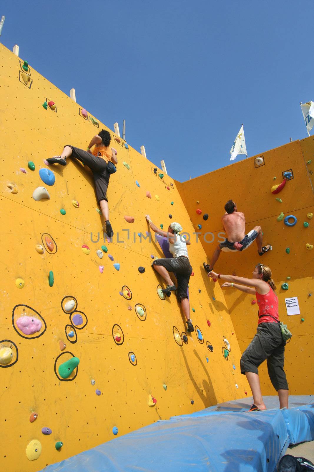 Annual Bouldering Competition on Scheveningen beach. Climbers at the climbing wall.