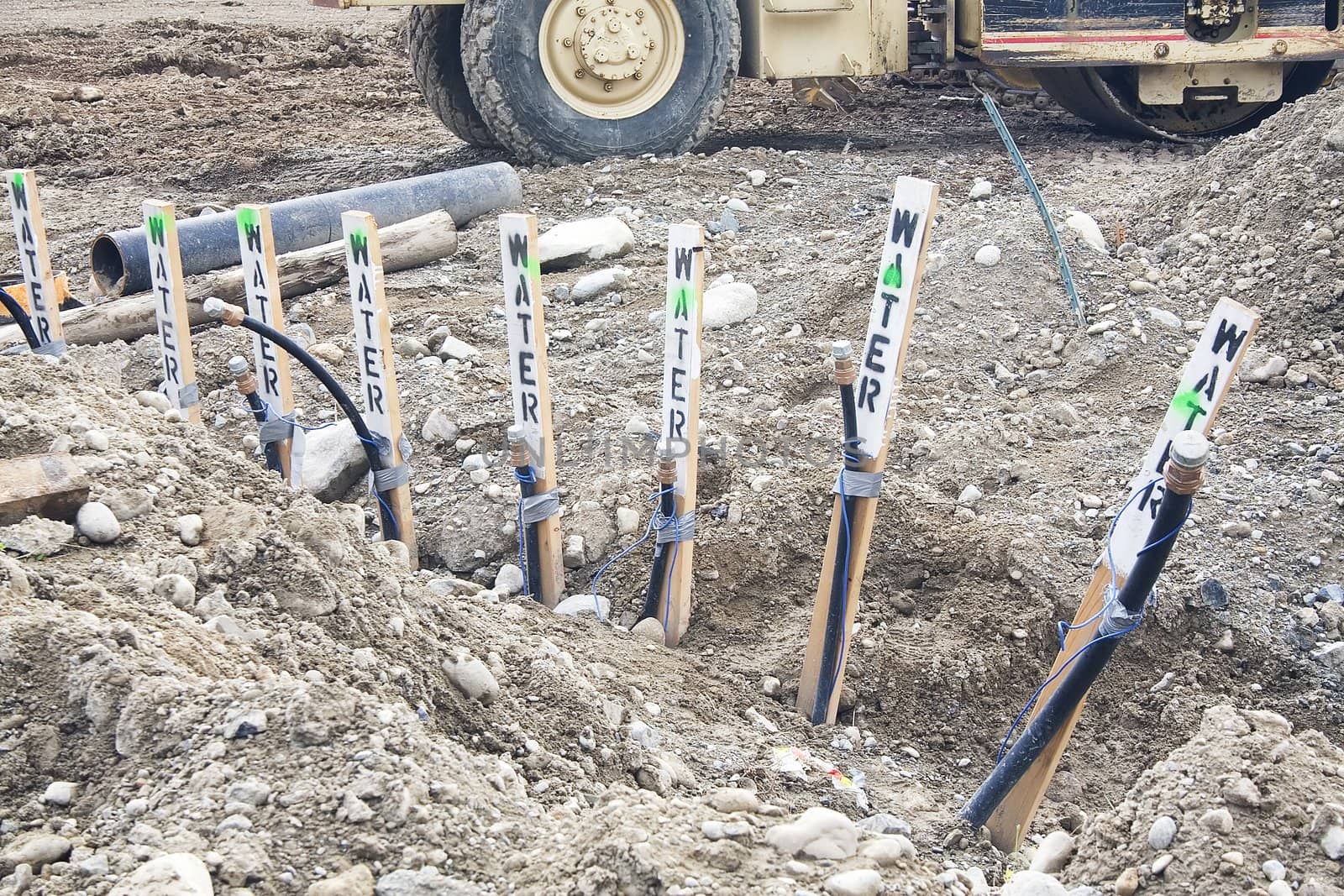Pipes for water service are ready for hooking up at a construction site.