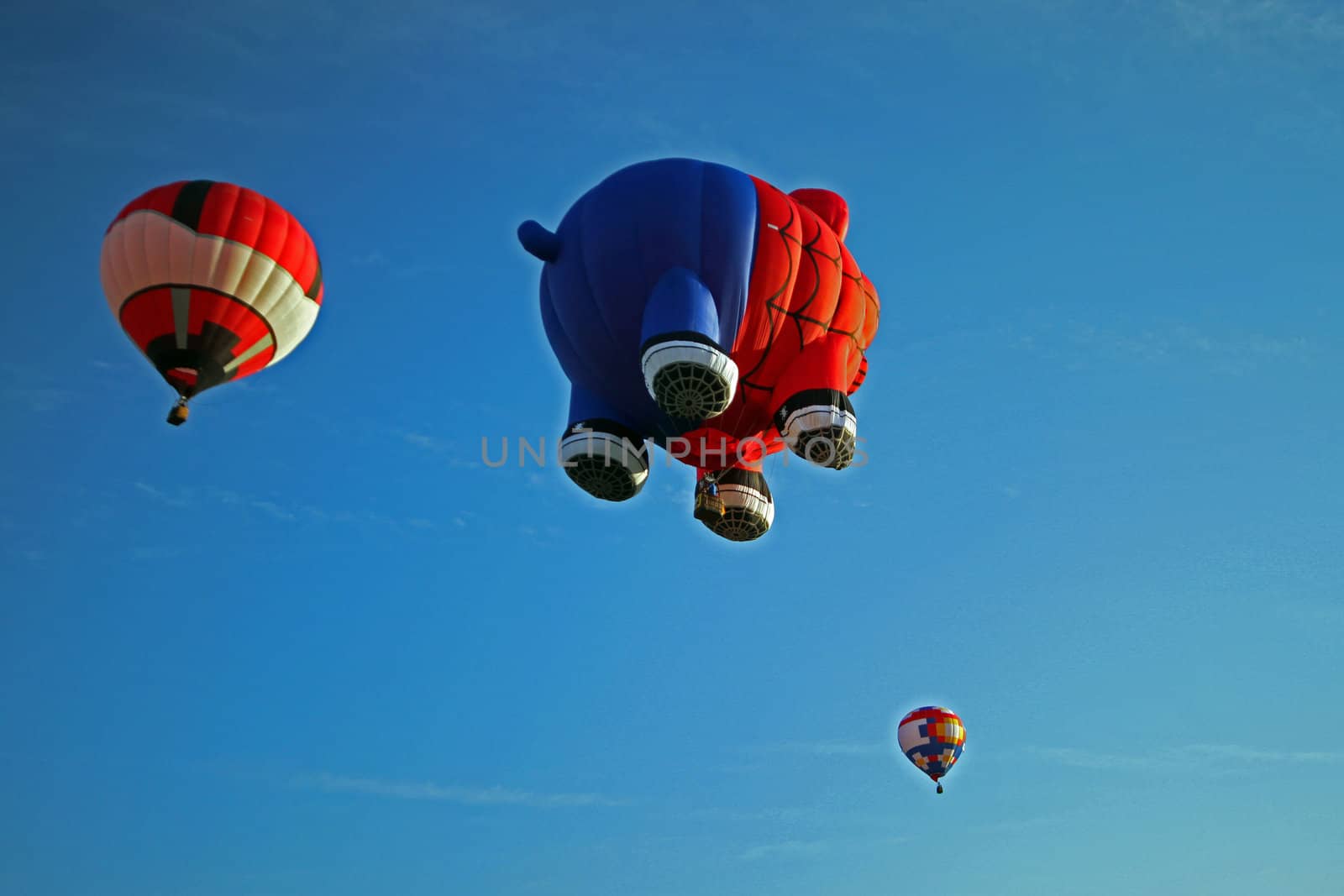 Hot air balloon shaped as a pig dressed in a spiderman suit