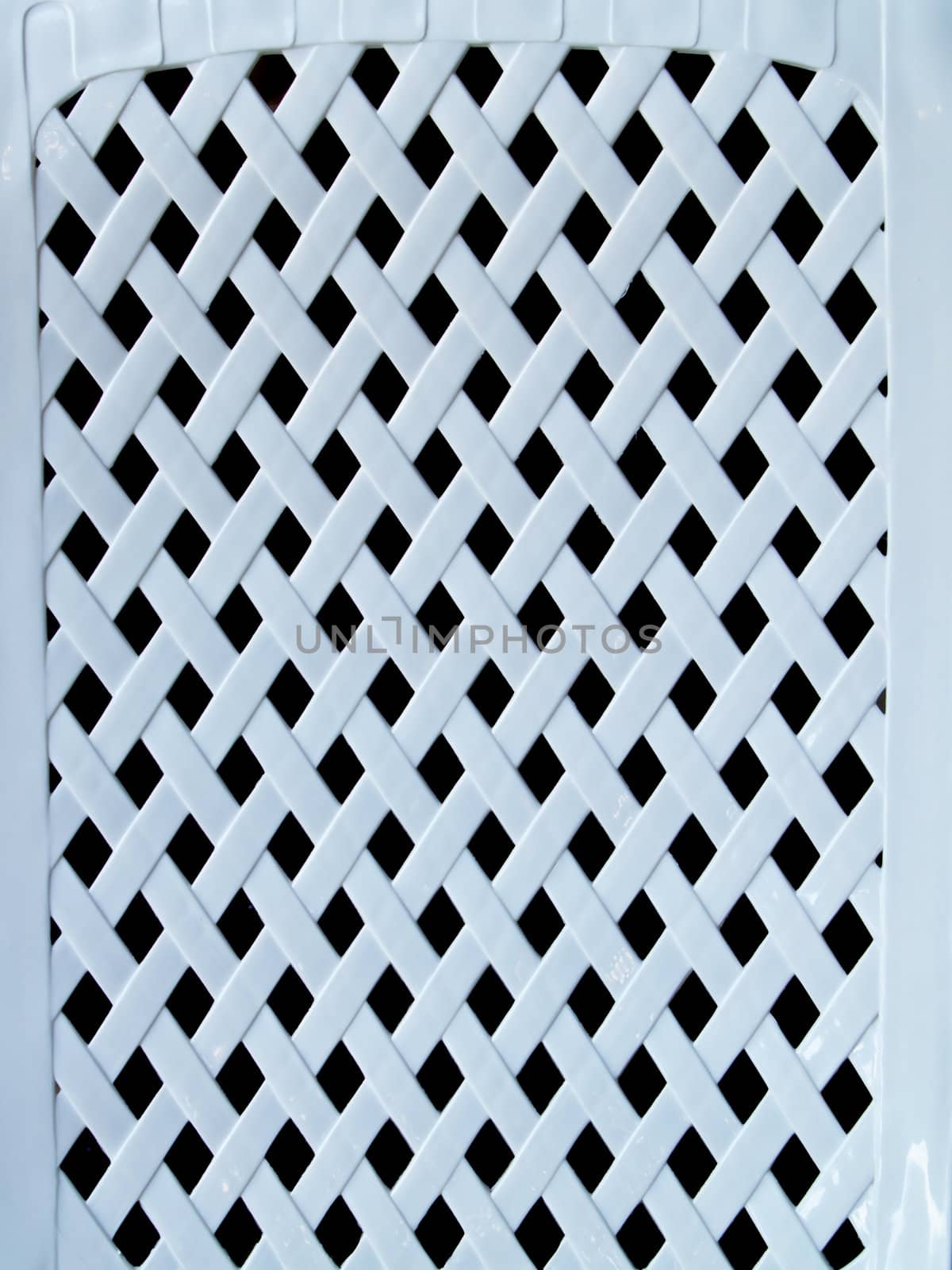 Closeup white plastic lattice on black background