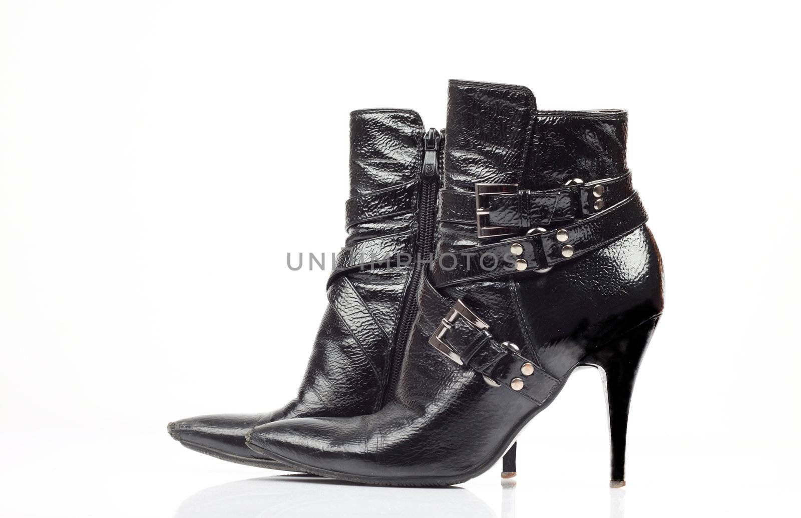 Black leather lady's boot over white 