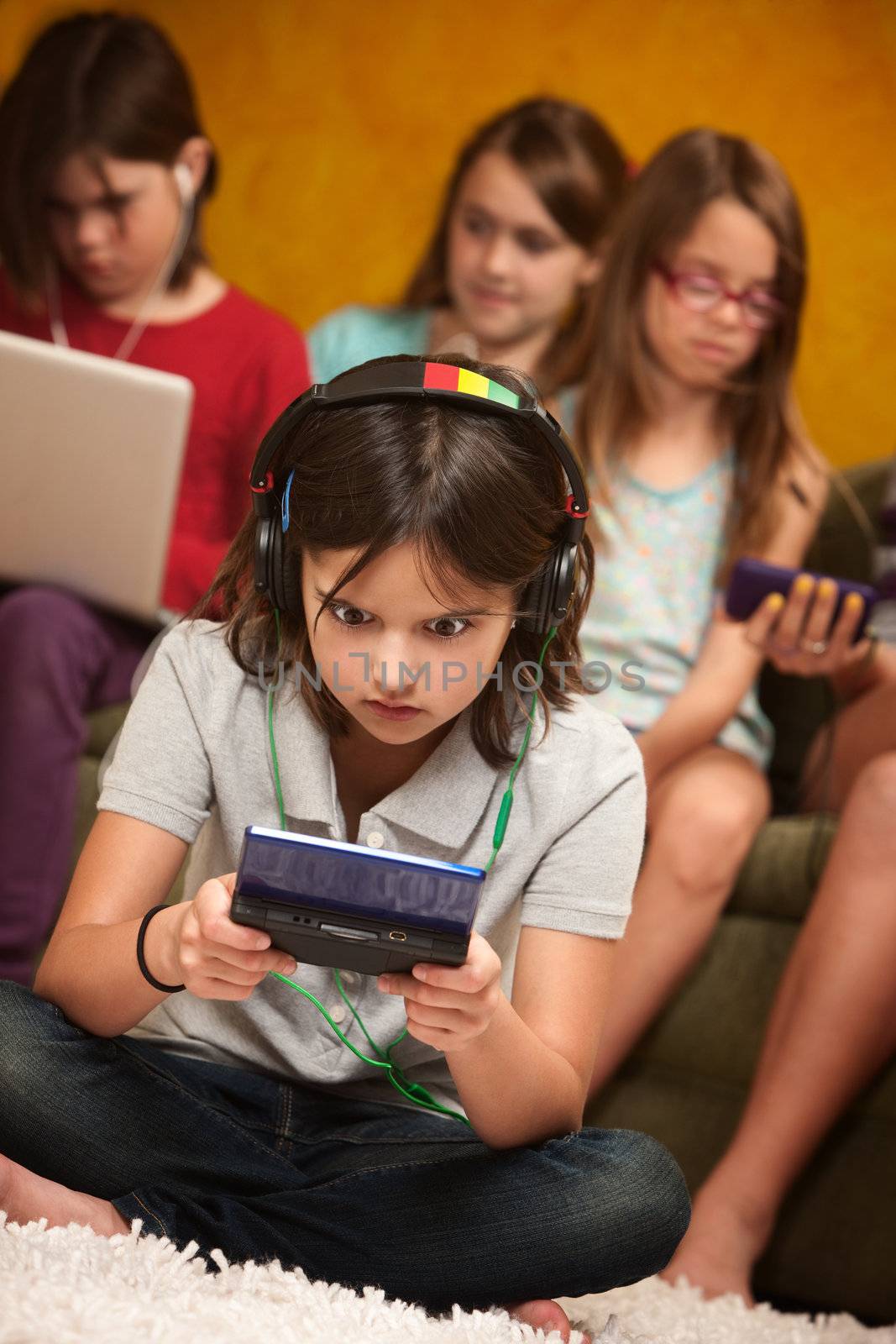 Little Girl Engrossed In Gaming by Creatista