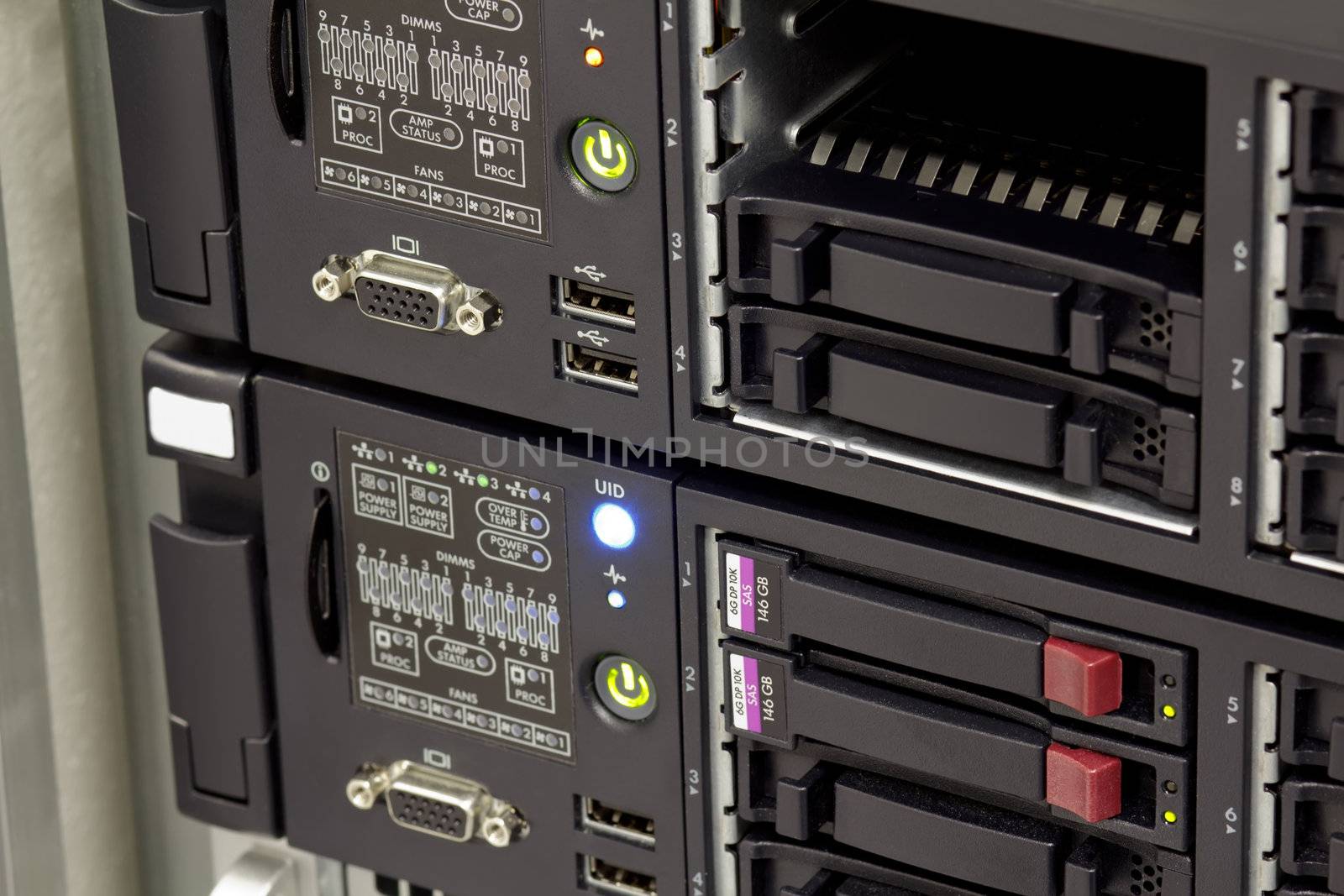 servers stack with hard drives in a datacenter by artush