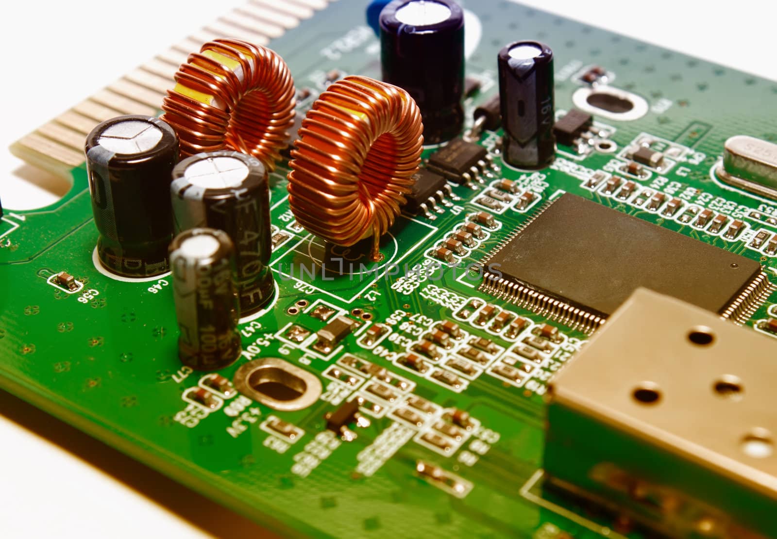 Closeup of a green electronic circuit board by artush