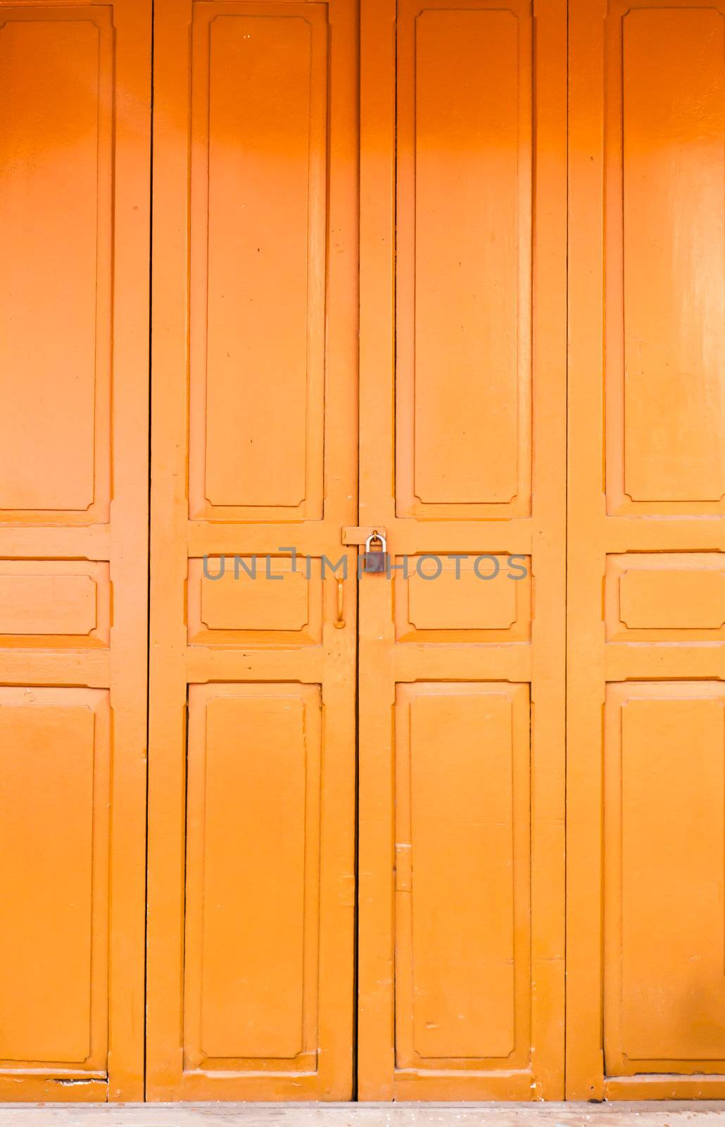 Closeup of an old wood orange door