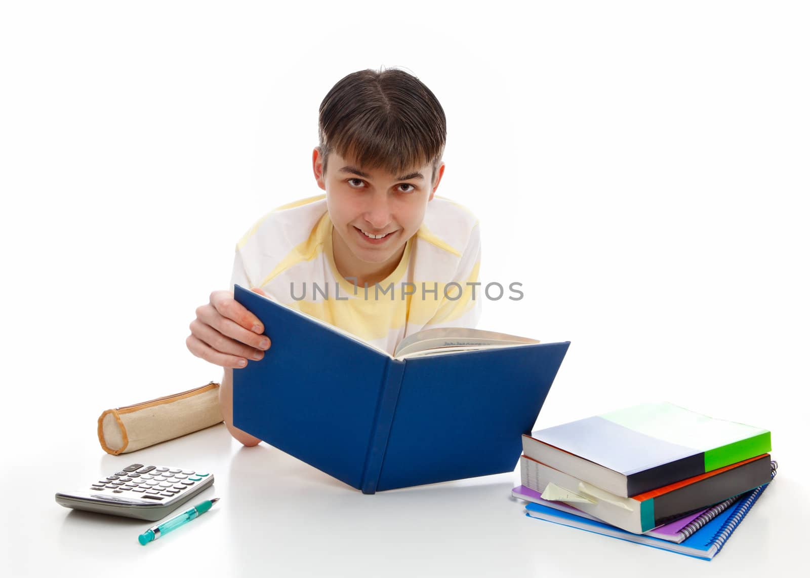 Smiling teenage student with textbooks and other materials.
