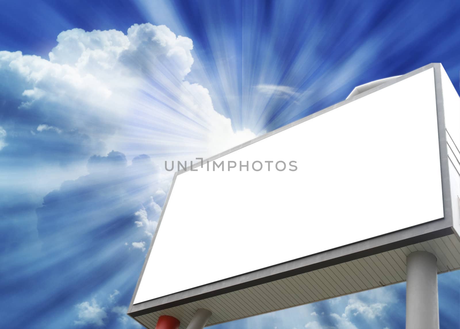 Blank billboard in a Dramatic blue sky with white clouds.