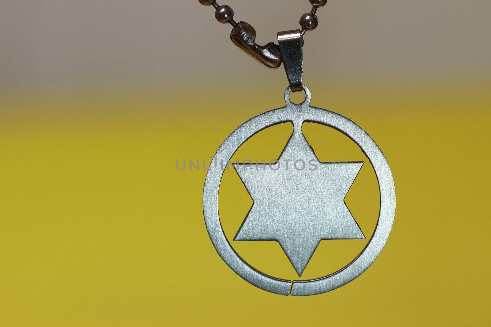 Judaism religious symbol - star of david isolated on yellow background.