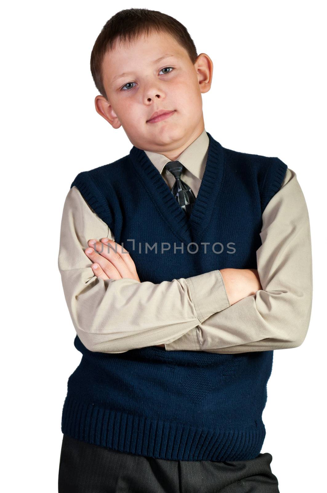 Schoolboy. Isolated over white background. The boy is dressed in a vest.